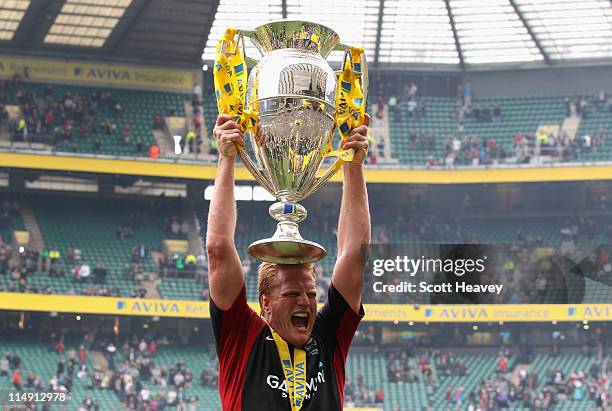 Hugh Vyvyan of Saracens lifts the trophy after the AVIVA Premiership Final between Leicester Tigers and Saracens at Twickenham Stadium on May 28,...