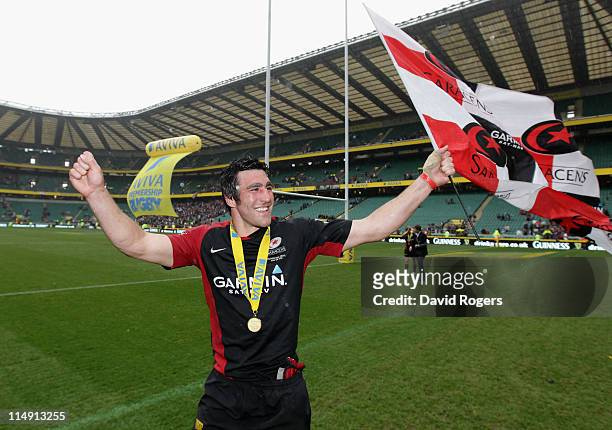 Kelly Brown of Saracens celebrates with a flag during the lap of honour during the AVIVA Premiership Final between Leicester Tigers and Saracens at...