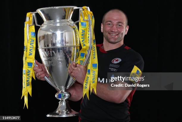 Captain Steve Borthwick of Saracens poses with the trophy following victory in the AVIVA Premiership Final between Leicester Tigers and Saracens at...