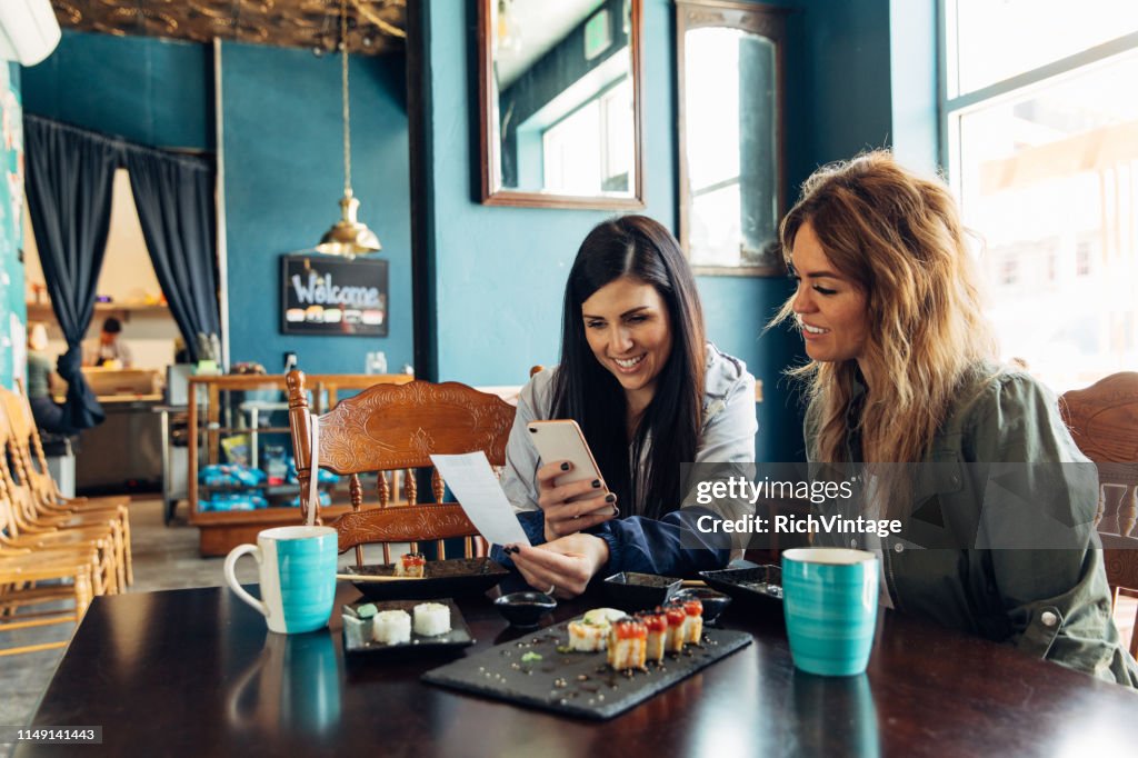 Woman Tracking Restaurant Bill