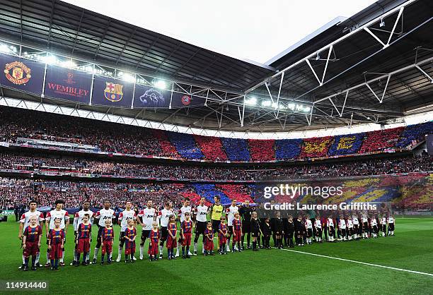 The teams line up ahead of the UEFA Champions League final between FC Barcelona and Manchester United FC at Wembley Stadium on May 28, 2011 in...