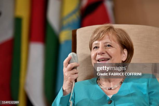 German Chancellor Angela Merkel smiles before her speech at the International Labour Organization Conference on June 11, 2019 in Geneva.