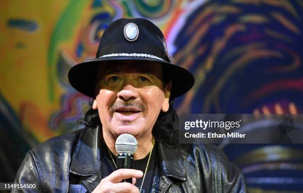 Recording artist Carlos Santana speaks during a listening event for his upcoming album "Africa Speaks" featuring singer Buika at the House of Blues...