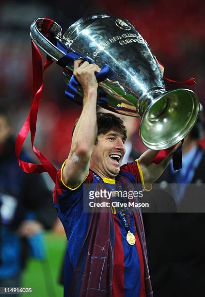 Lionel Messi of FC Barcelona lifts the trophy after victory in UEFA Champions League final between FC Barcelona and Manchester United FC at Wembley...