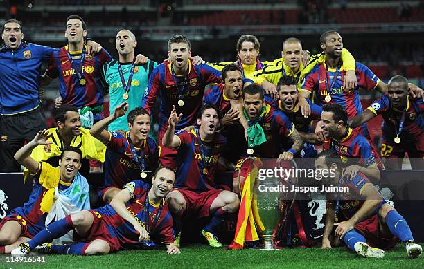 Barcelona pose for photographs as they celebrate victory in the UEFA Champions League final between FC Barcelona and Manchester United FC at Wembley...