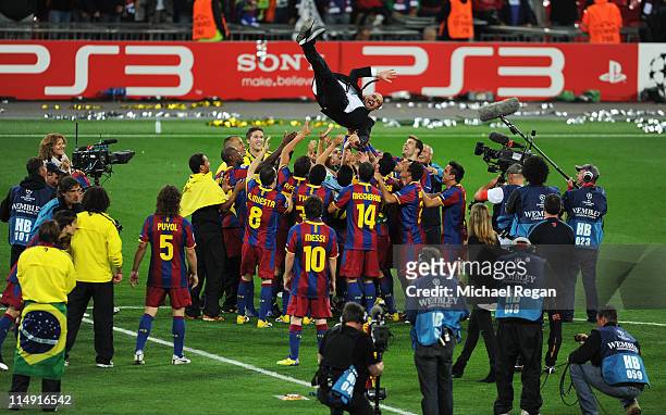 Josep Guardiola manager of FC Barcelona is thrown in the air as Barcelona celebrate victory in UEFA Champions League final between FC Barcelona and...