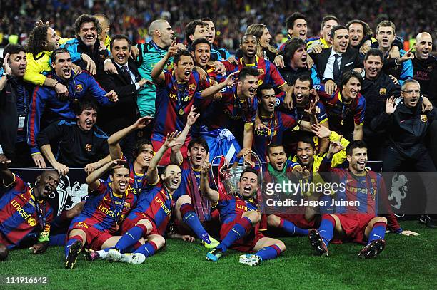 Barcelona pose for photographs as they celebrate victory in the UEFA Champions League final between FC Barcelona and Manchester United FC at Wembley...