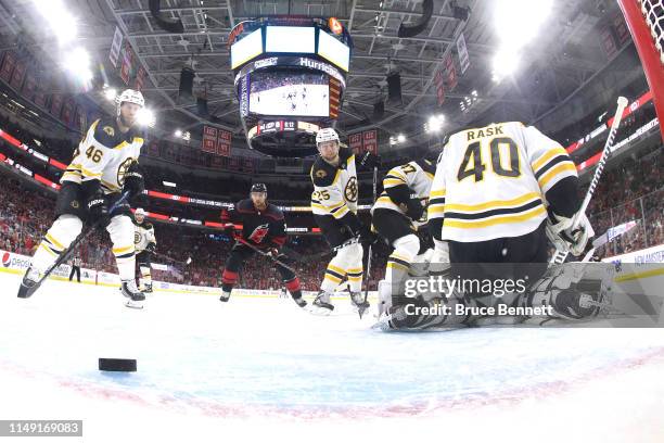 Tuukka Rask of the Boston Bruins gives up a goal to Calvin de Haan of the Carolina Hurricanes during the second period in Game Three of the Eastern...