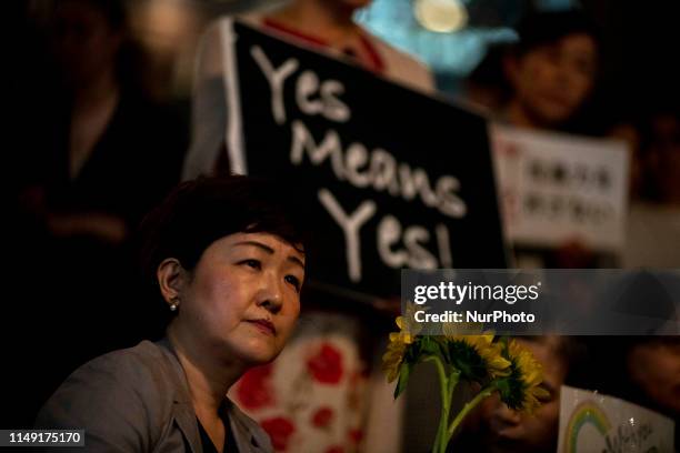 Protesters, about 150, gather at the rally called 'Flower Demo' to criticize recent acquittals in court cases of alleged rape in Japan and call for...