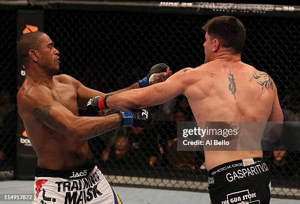 Brian Stann punches Jorge Santiago during their middleweight fight at UFC 130 at the MGM Grand Garden Arena on May 28, 2011 in Las Vegas, Nevada.