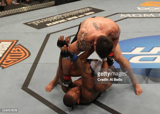 Brian Stann finishes off Jorge Santiago with punches after knocking him down during their middleweight fight at UFC 130 at the MGM Grand Garden Arena...