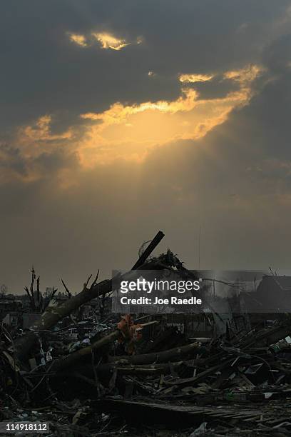Homes that were destroyed when a massive tornado passed through killing at least 142 people on May 28, 2011 in Joplin, Missouri. Denizens continue...