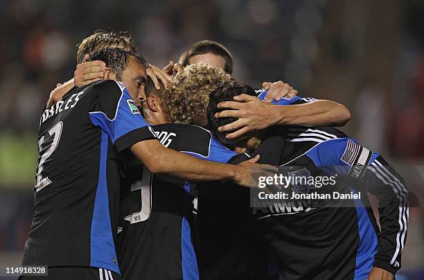 Chris Wondolowski of the San Jose Earthquakes is greeted by teammates including Ramiro Corrales, Steven Lenhart and Anthony Ampaipitakwong as they...