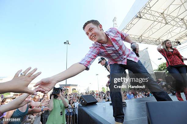 In this handout photo provided by Microsoft, 'American Idol' season 10 winner Scotty McCreery greets fans after performing in celebration of the...