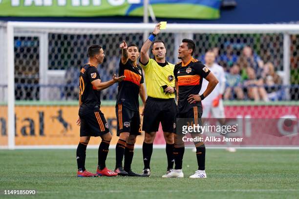 DeLaGarza, Matias Vera, and Darwin Ceren of Houston Dynamo disapprove with the referee's call during the match against the Seattle Sounders at...