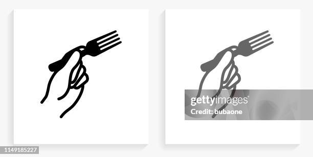 hand holding fork black and white square icon - hand fork stock illustrations