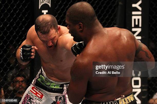 Matt Hamill punches Quinton "Rampage" Jackson during their light heavyweight fight at UFC 130 at the MGM Grand Garden Arena on May 28, 2011 in Las...
