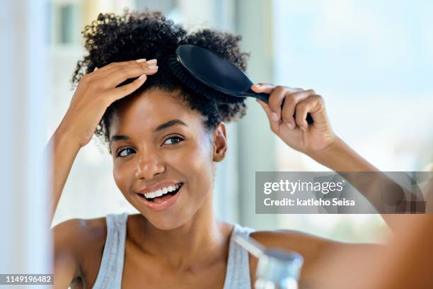 brushing her way to an awesome hair day - hairbrush stock pictures, royalty-free photos & images