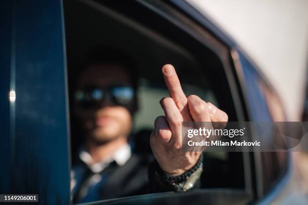 angry businessman shows middle finger - doigt dhonneur stock pictures, royalty-free photos & images
