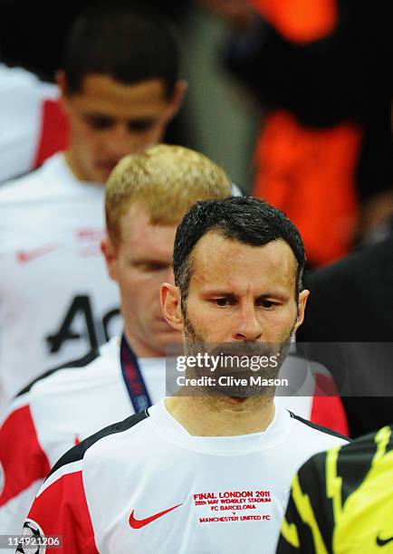 Ryan Giggs of Manchester United looks dejected after defeat in the UEFA Champions League final between FC Barcelona and Manchester United FC at...