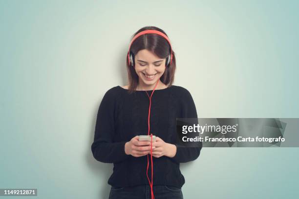 music passion - girl with earphones stock pictures, royalty-free photos & images