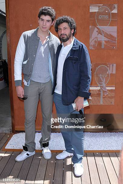 Radu Mihaileanu and his Son Yuri attend the French open at Roland Garros on May 29, 2011 in Paris, France.
