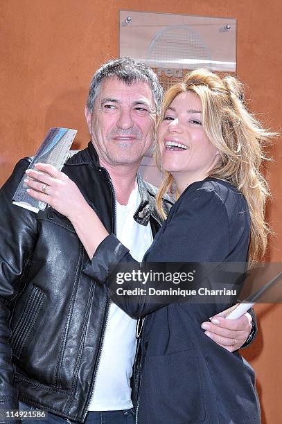 Jean-Marie Bigard and his wife Lola Marois attend the French open at Roland Garros on May 29, 2011 in Paris, France.