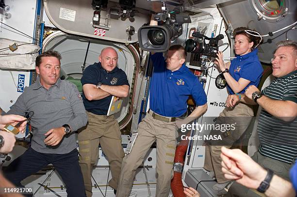 In this handout provided by National Aeronautics and Space Administration , STS-134 and Expedition 27 crew members are pictured in the Harmony node...