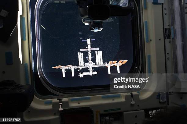 In this handout provided by National Aeronautics and Space Administration , the International Space Station is featured in this image photographed by...
