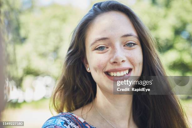 beautiful smiling young brunette woman with cute dimples - brown hair blue eyes and dimples stock pictures, royalty-free photos & images