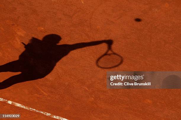 Jelena Jankovic of Serbia casts a shadow as she serves during the women's singles round four match between Jelena Jankovic of Serbia and Francesca...