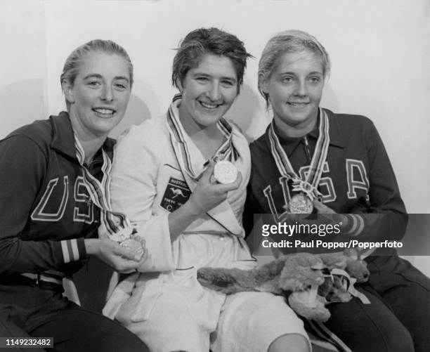 View of the medal winners, from left, silver medallist Sharon Stouder of the United States, gold medallist Dawn Fraser of Australia and bronze...