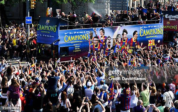 Barcelona players celebrate on board an open top bus after winning the UEFA Champions League Final against Manchester United, on May 29, 2011 in...