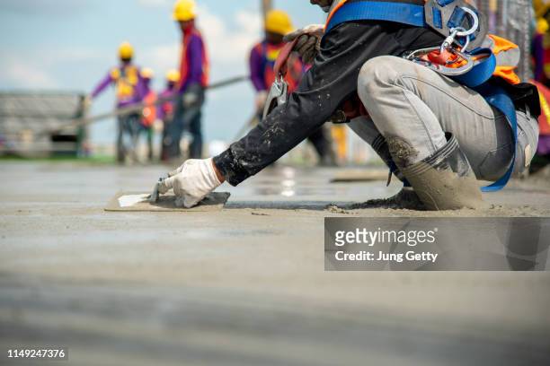 close up hand construction worker - cement construction stock pictures, royalty-free photos & images