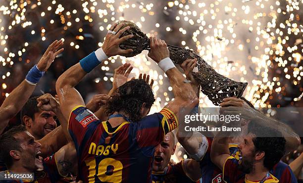 Captain Laszlo Nagy of Barcelona lifts the trophy after winning the EHF Final Four final match between FC Barcelona Borges and Ciudad Real at Lanxess...