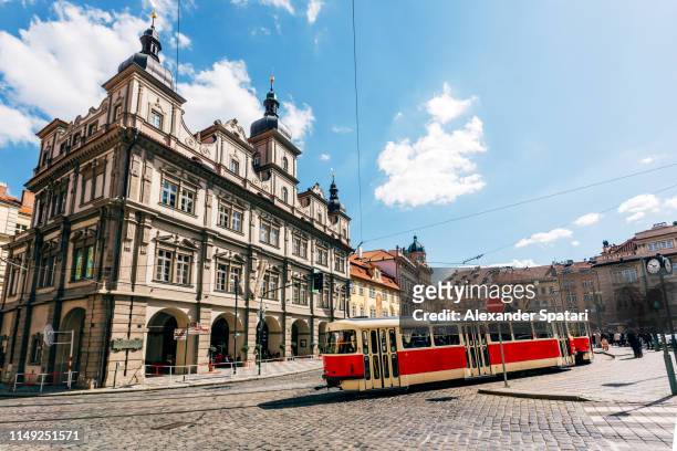street in prague with red old tram, bohemia, czech republic - czech republic stock-fotos und bilder