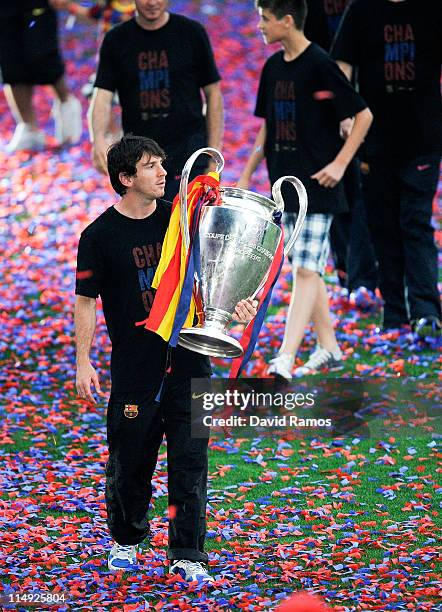 Lionel Messi of FC Barcelona holds the UEFA Champions League Trophy during the celebrations after winning the UEFA Champions League Final against...