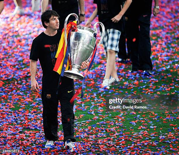 Lionel Messi of FC Barcelona holds the UEFA Champions League Trophy during the celebrations after winning the UEFA Champions League Final against...