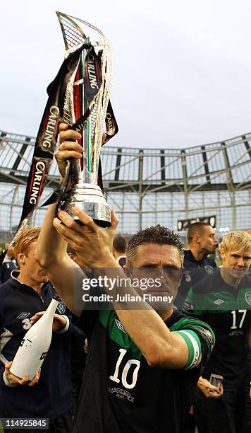 Robbie Keane of Republic of Ireland lifts the Four Nations Cup after their win over Scotland at the Aviva Stadium on May 29, 2011 in Dublin, Ireland.