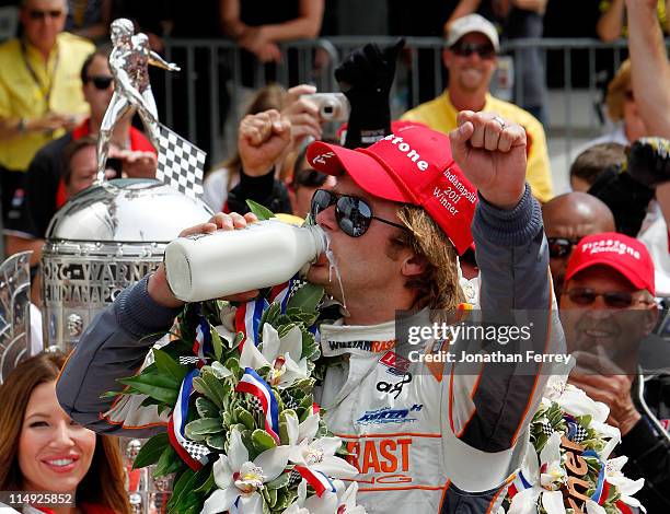 Dan Wheldon of England, driver of the William Rast-Curb/Big Machine Dallara Honda, celebrates in victory lane after winning the IZOD IndyCar Series...