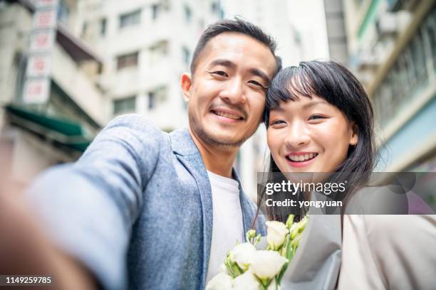 asian couple taking a selfie - yongyuan hongkong stock pictures, royalty-free photos & images