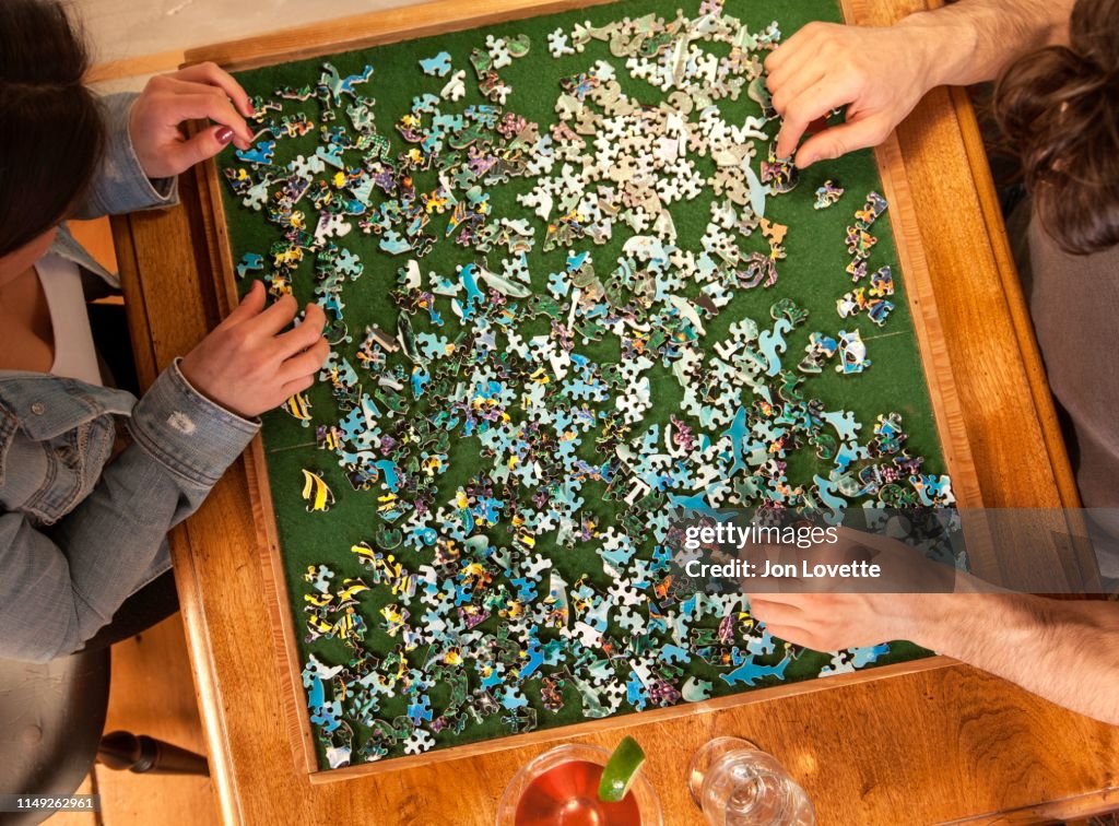 Couple playing puzzle