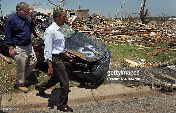 President Barack Obama and Missouri Governor Jay Nixon walk together during a visit to the community that was devastated a week ago by a tornado on...