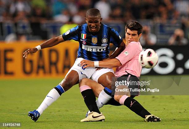 Ezequiel Munoz of Palermo and Samuel Eto'o of Inter battle for the ball during the Tim Cup final between FC Internazionale Milano and US Citta di...