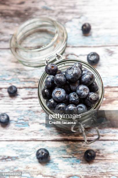 fresh blueberries in a glass - blaubeeren stock pictures, royalty-free photos & images