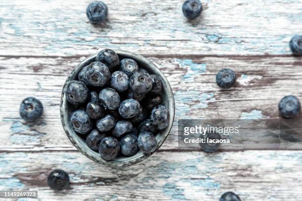 fresh blueberries in bowl - blaubeeren stock pictures, royalty-free photos & images