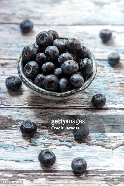 fresh blueberries in bowl - blaubeeren stock pictures, royalty-free photos & images
