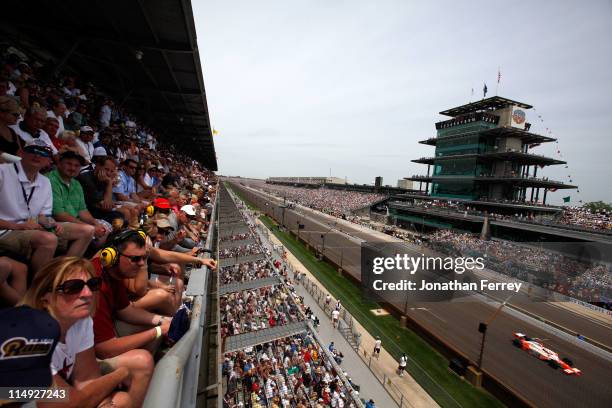 Dan Wheldon of England, driver of the William Rast-Curb/Big Machine Dallara Honda, races during the IZOD IndyCar Series Indianapolis 500 Mile Race at...