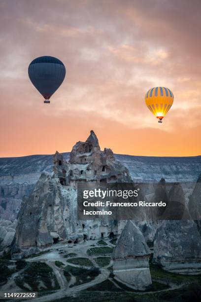 cappadocia, turkey. wonderful sunrise over pinnacles with balloons - göreme stock pictures, royalty-free photos & images