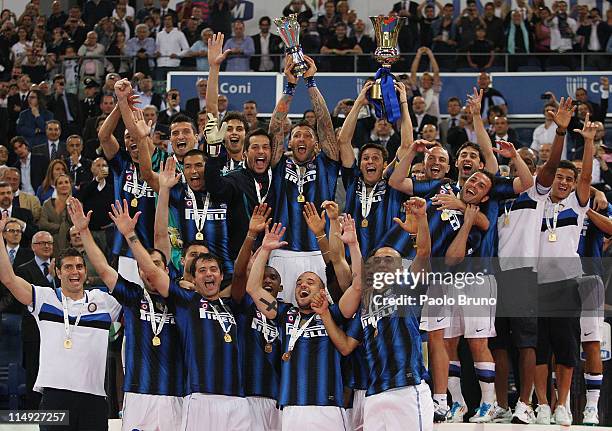 Javier Zanetti and Marco Materazzi with their teammates of FC Internazionale Milano hold the trophy after the victory of Tim Cup final between FC...